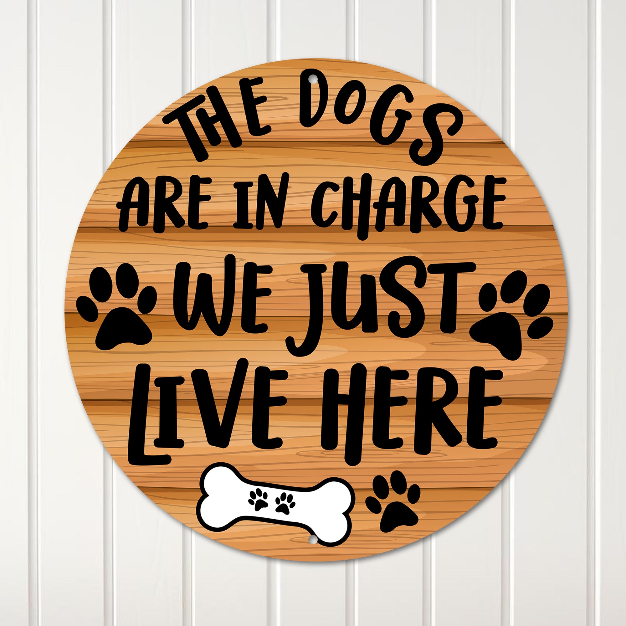 Personalized Round Metal Sign for Dog Lovers - "The Dogs Are in Charge, We Just Live Here" with Paw Prints and Bone Design - Image 1